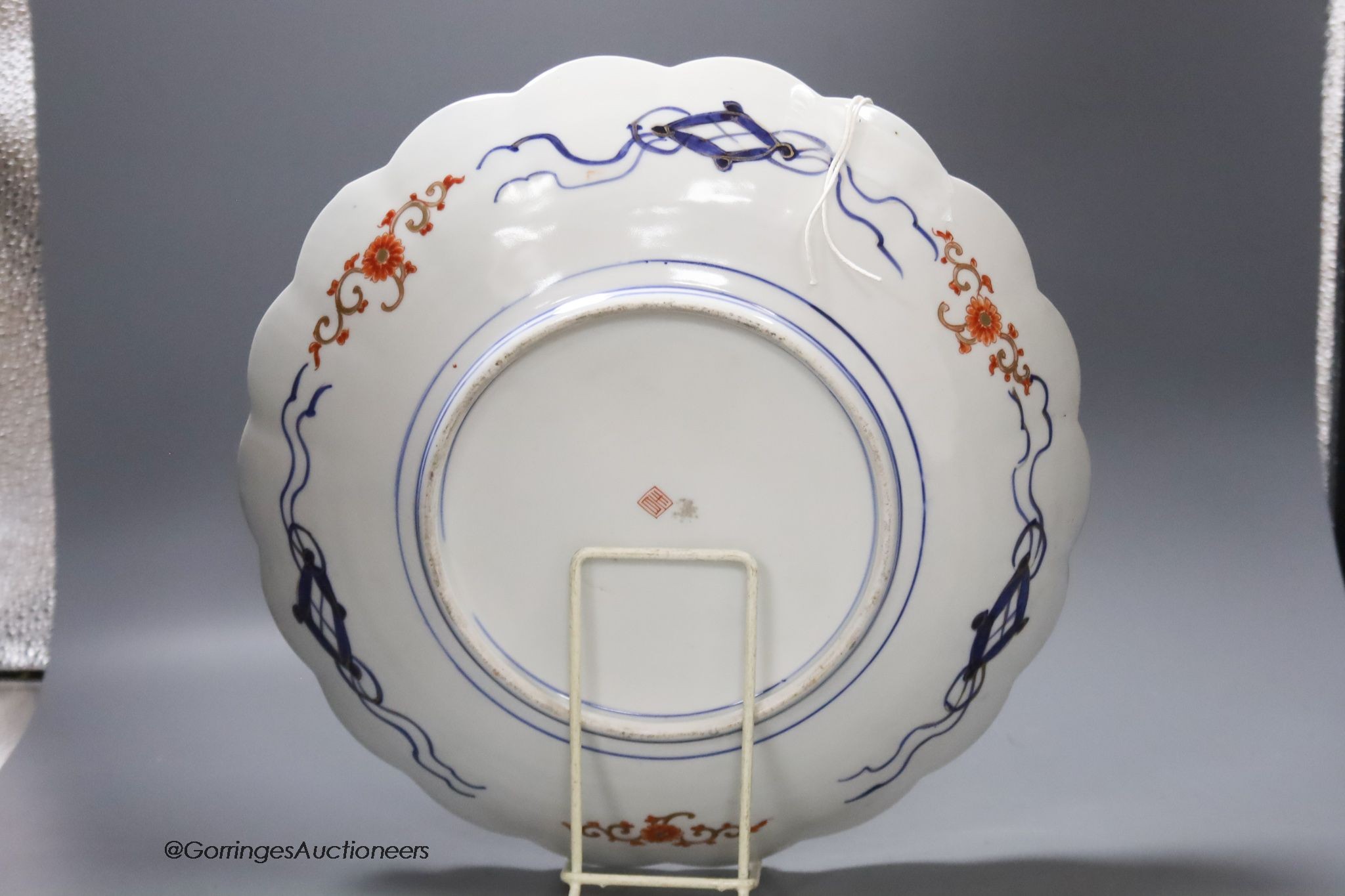 A Chinese famille rose jardiniere, height 29cm, and a Japanese imari dish